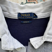 Polo Ralph Lauren navy rugby polo shirt with thick stripes and embroidered logo.