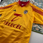 Adidas orange Benfica away jersey with embroidered logo and vintage design details.
