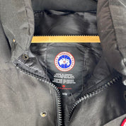 Canada Goose black puffer gilet with logo patch and quilted design.