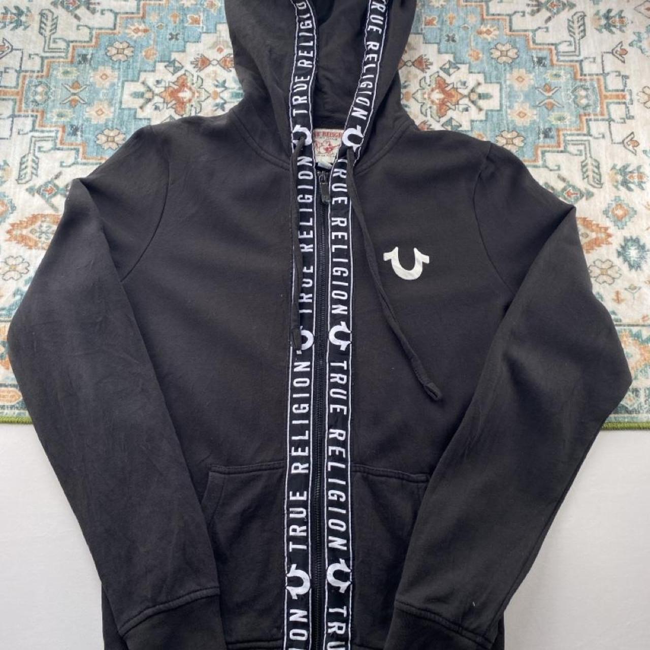 True Religion black and white full zip hoodie with logo and contrast stitching.