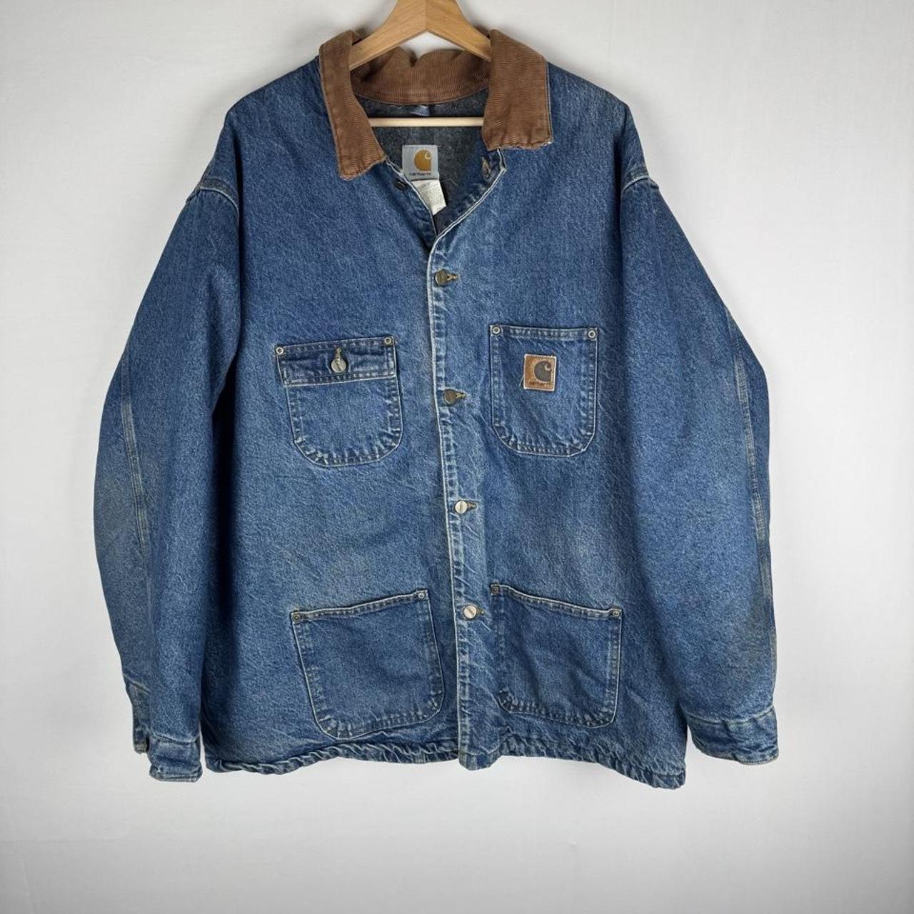 Carhartt denim chore jacket oversized 1990s style with classic logo and blue wash.