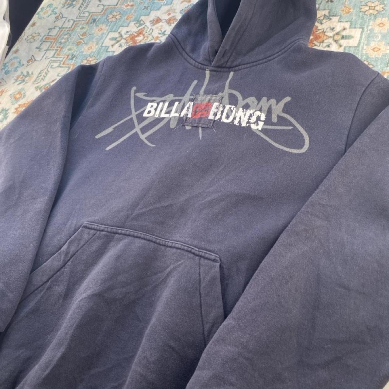 Billabong navy oversized hoodie with logo detail and soft material.