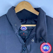 Canada Goose black down filled gilet with logo patch and zippered pockets.