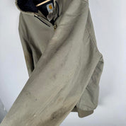 Carhartt active jacket, orange, oversized fit, visible logo, durable material.