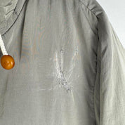 CP Company multi-colour utility parka jacket with multiple pockets and hood.