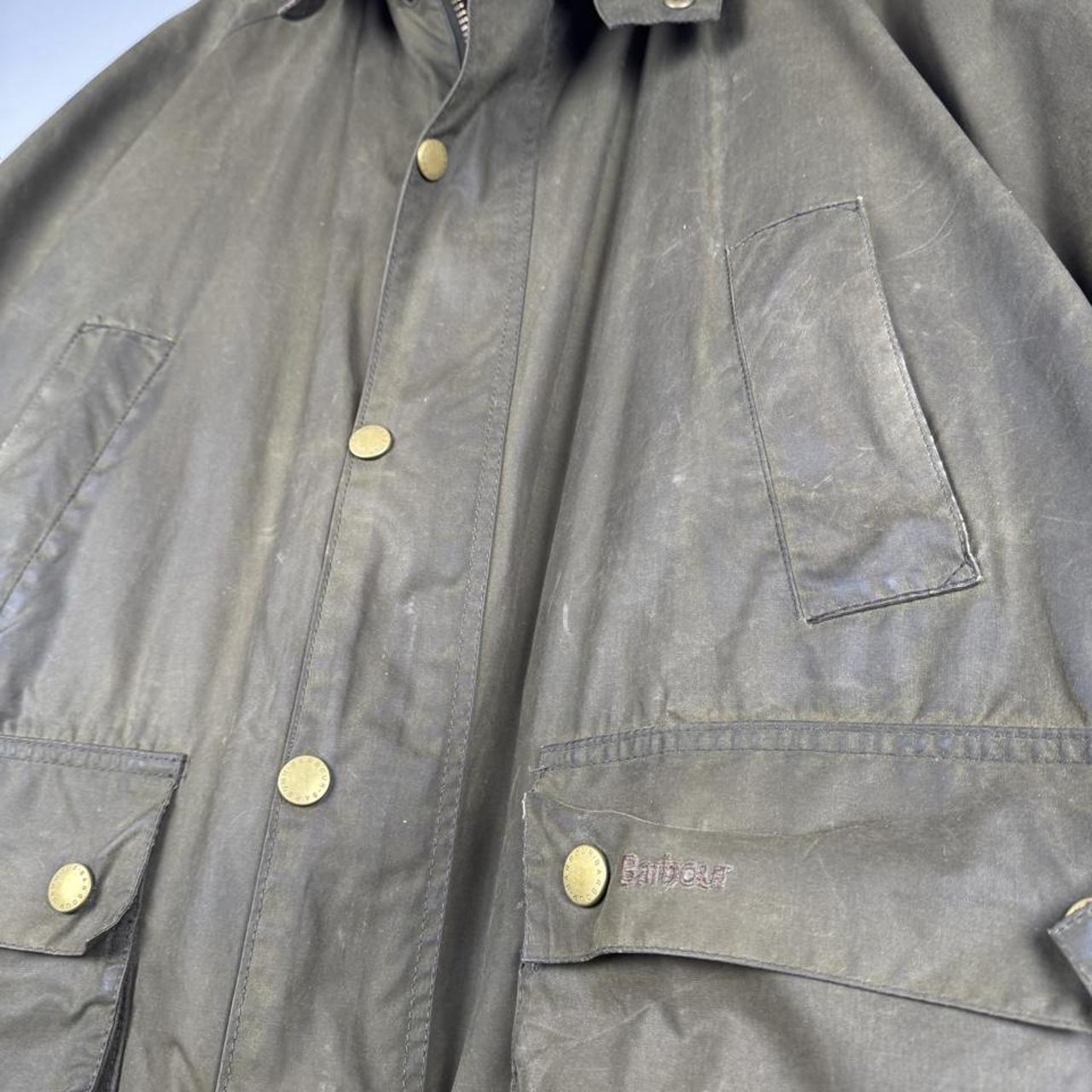 Barbour green wax jacket with logo, classic design, and durable material.