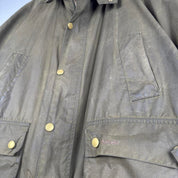 Barbour green wax jacket with logo, classic design, and durable material.