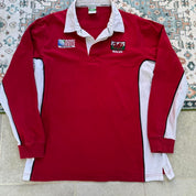 Wales red rugby polo shirt with embroidered logo and World Cup details.