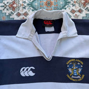 Canterbury men's rugby polo shirt, navy blue, featuring Harper Adams University logo and classic collar.