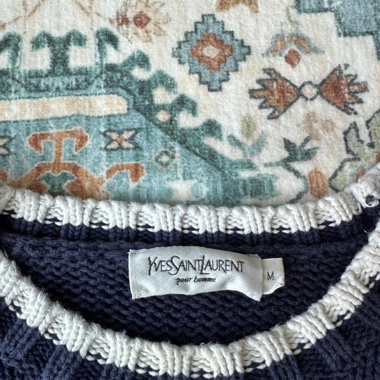 Yves Saint Laurent navy sweatshirt with white trim and embroidered YSL logo.