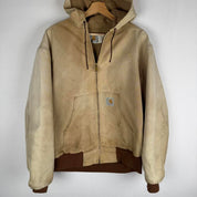 Carhartt cream distressed active jacket with logo patch and relaxed fit.