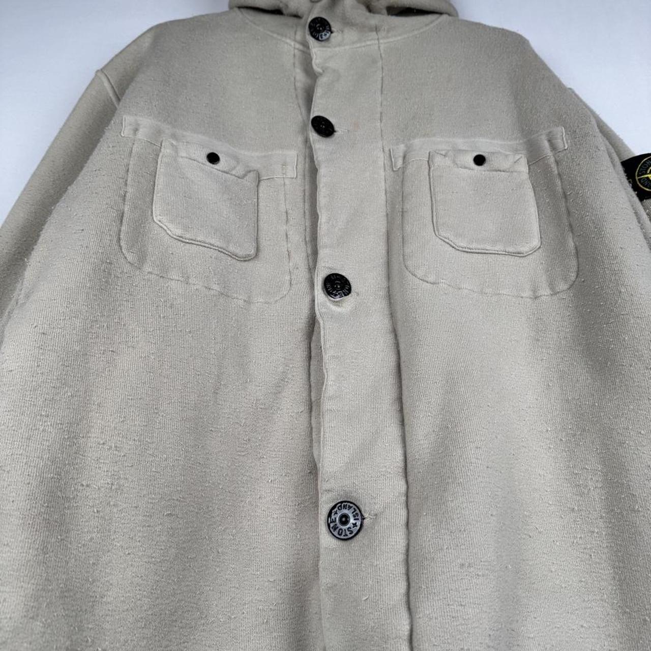 Stone Island cream hoodie jacket with sherpa lining and logo patch.