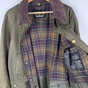 Barbour green wax jacket with logo, classic design, and durable material.
