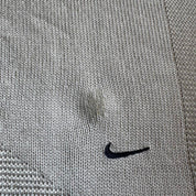 Nike cream knitted jumper with embroidered logo and visible marks from the 1990s.