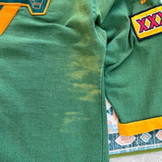 Umbro men's polo shirt green with Wallabies logo and rugby league pattern.
