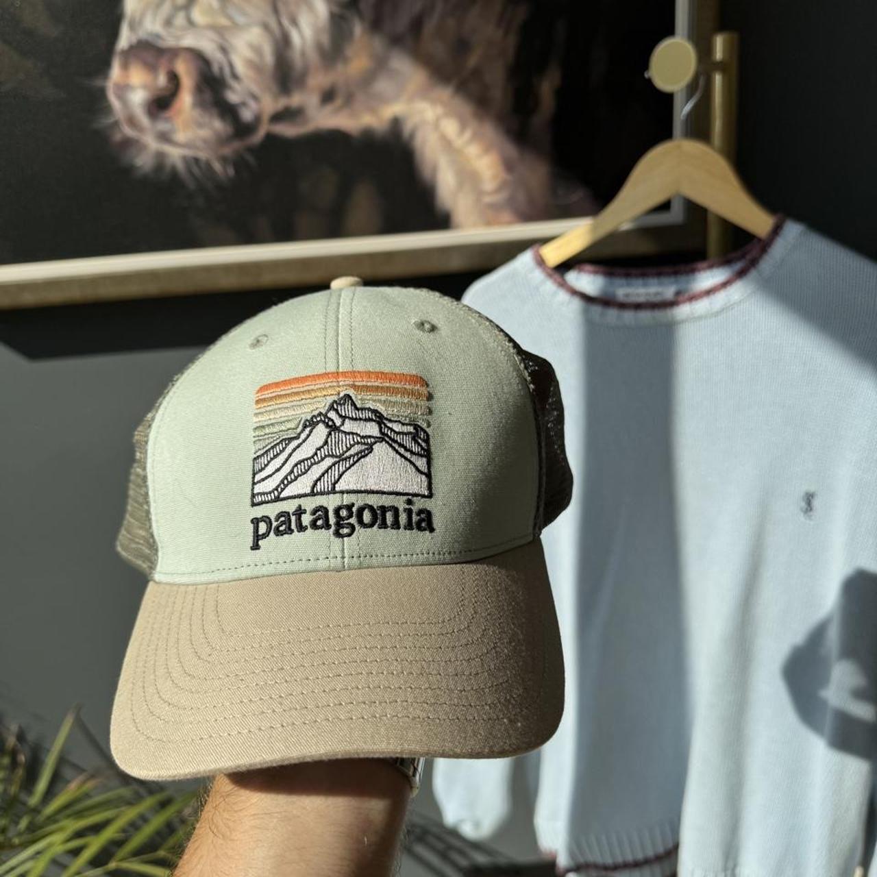 Patagonia khaki trucker cap with embroidered logo and mesh back.