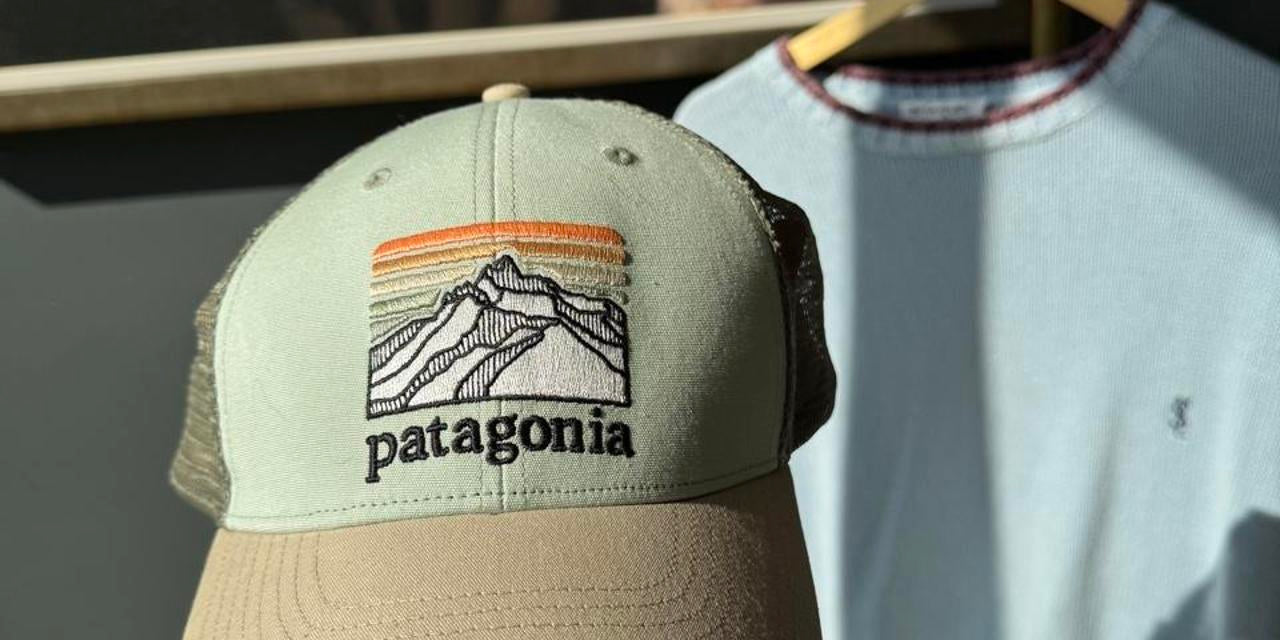 Patagonia khaki trucker cap with embroidered logo and mesh back.