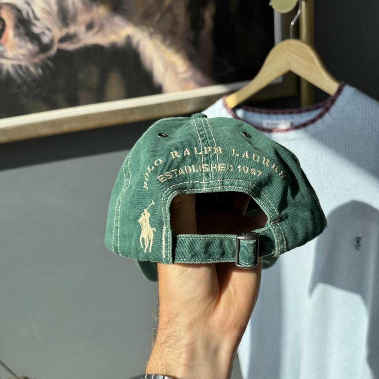 Polo Ralph Lauren cream cap with embroidered flag logo detail.