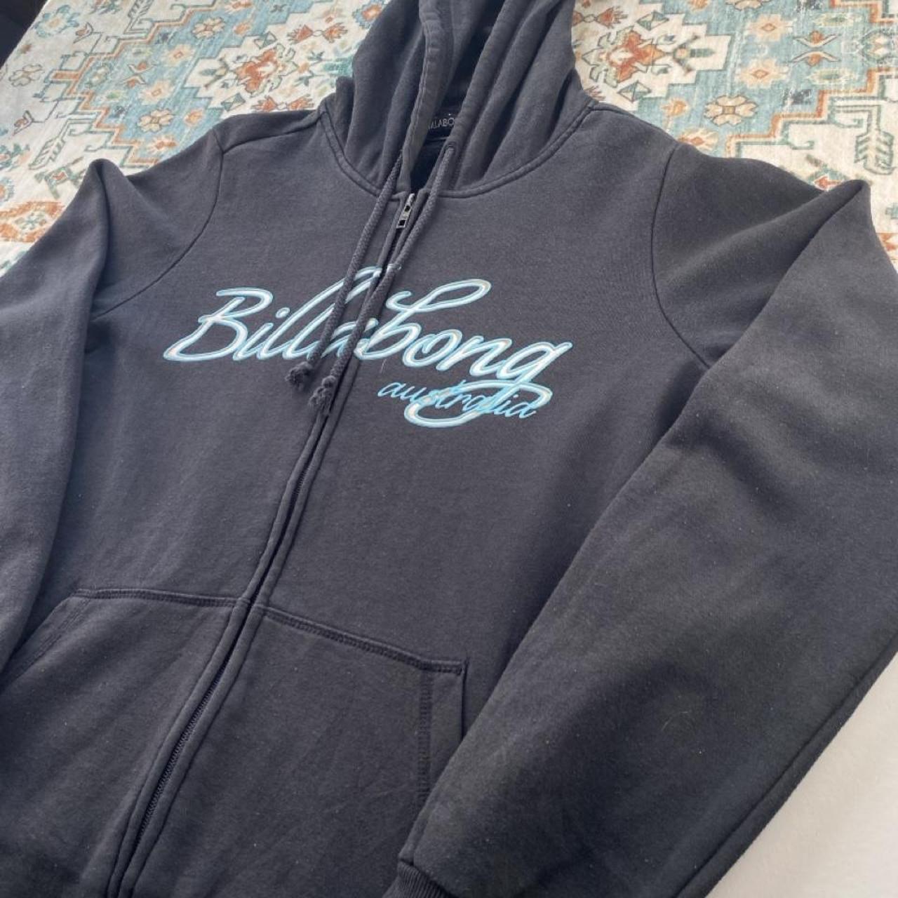Billabong black oversized full zip hoodie with logo detail and soft material.