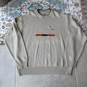 Nike cream knitted jumper with embroidered logo and visible marks from the 1990s.