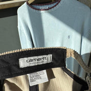 Carhartt WIP cream corduroy cap with embroidered logo detail.