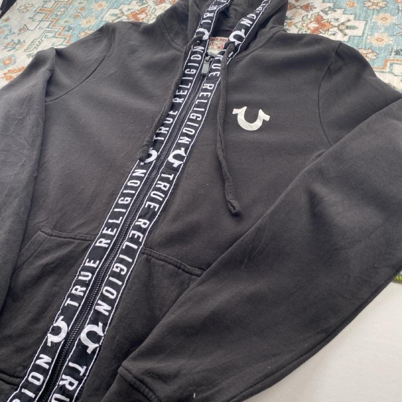 True Religion black and white full zip hoodie with logo and contrast stitching.