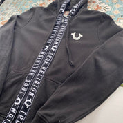 True Religion black and white full zip hoodie with logo and contrast stitching.