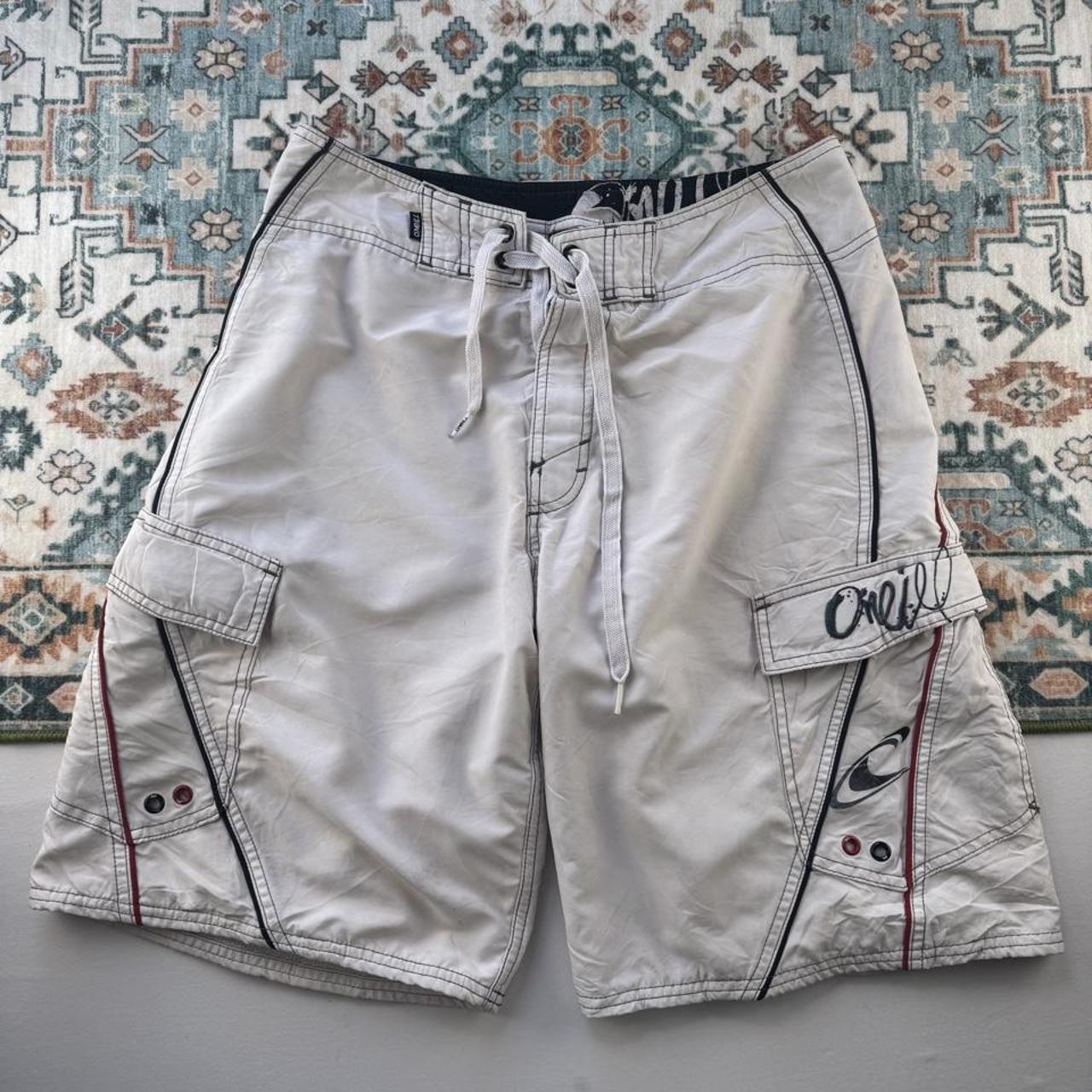 O'Neill cream board shorts with embroidered logo and relaxed baggy fit.