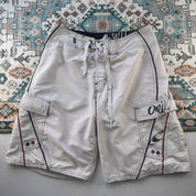 O'Neill cream board shorts with embroidered logo and relaxed baggy fit.