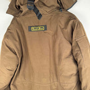 Canada Goose brown parka jacket with utility pockets and logo patch.