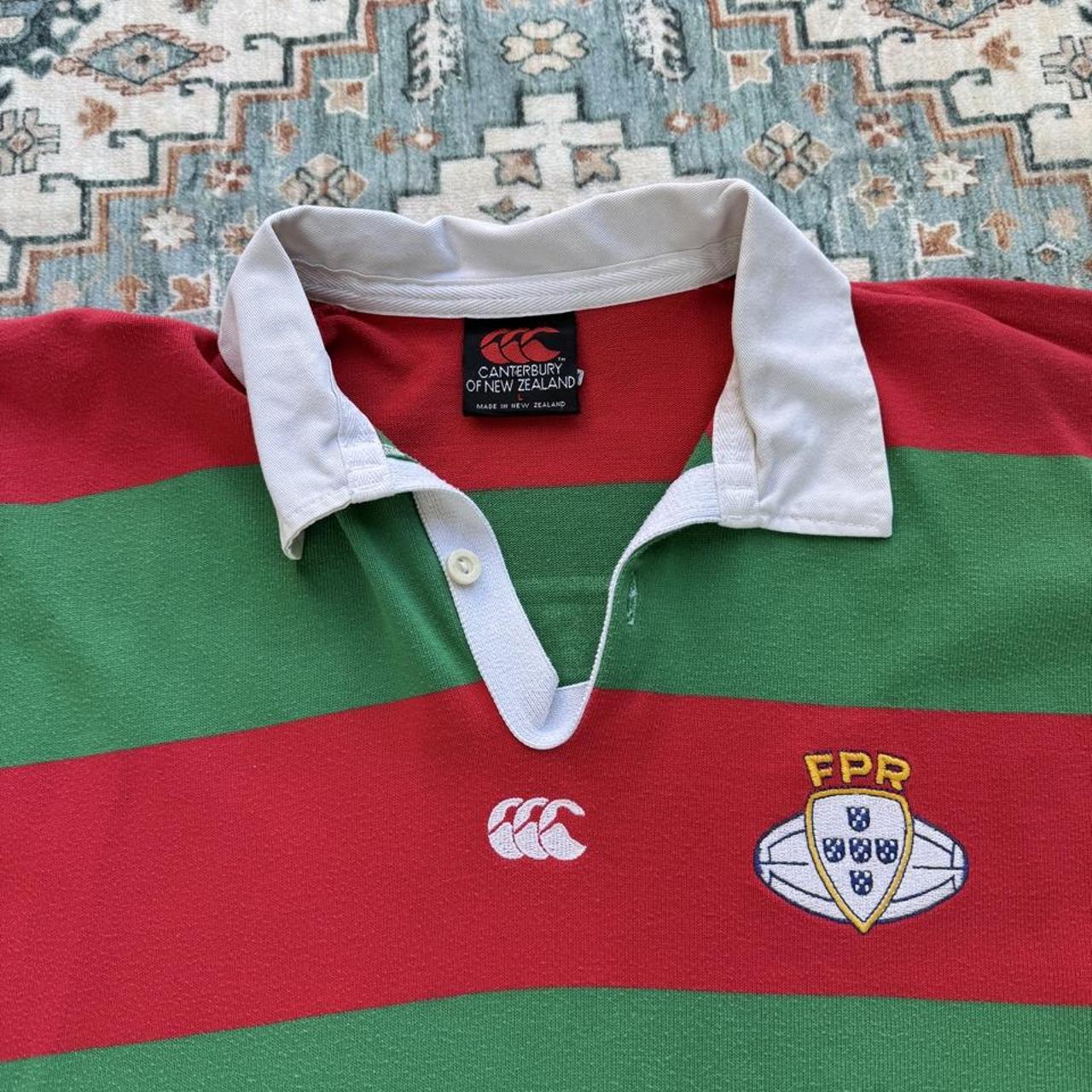 Canterbury men's rugby polo shirt red with embroidered Portugal logo and classic collar.