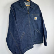 Carhartt WIP blue denim jacket with logo patch and classic design details.