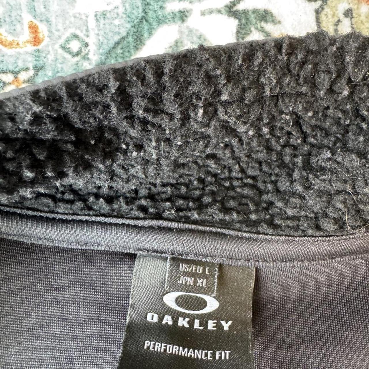Oakley fleece jacket in cream with embroidered spellout logo and soft sherpa texture.