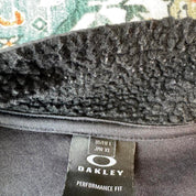 Oakley fleece jacket in cream with embroidered spellout logo and soft sherpa texture.