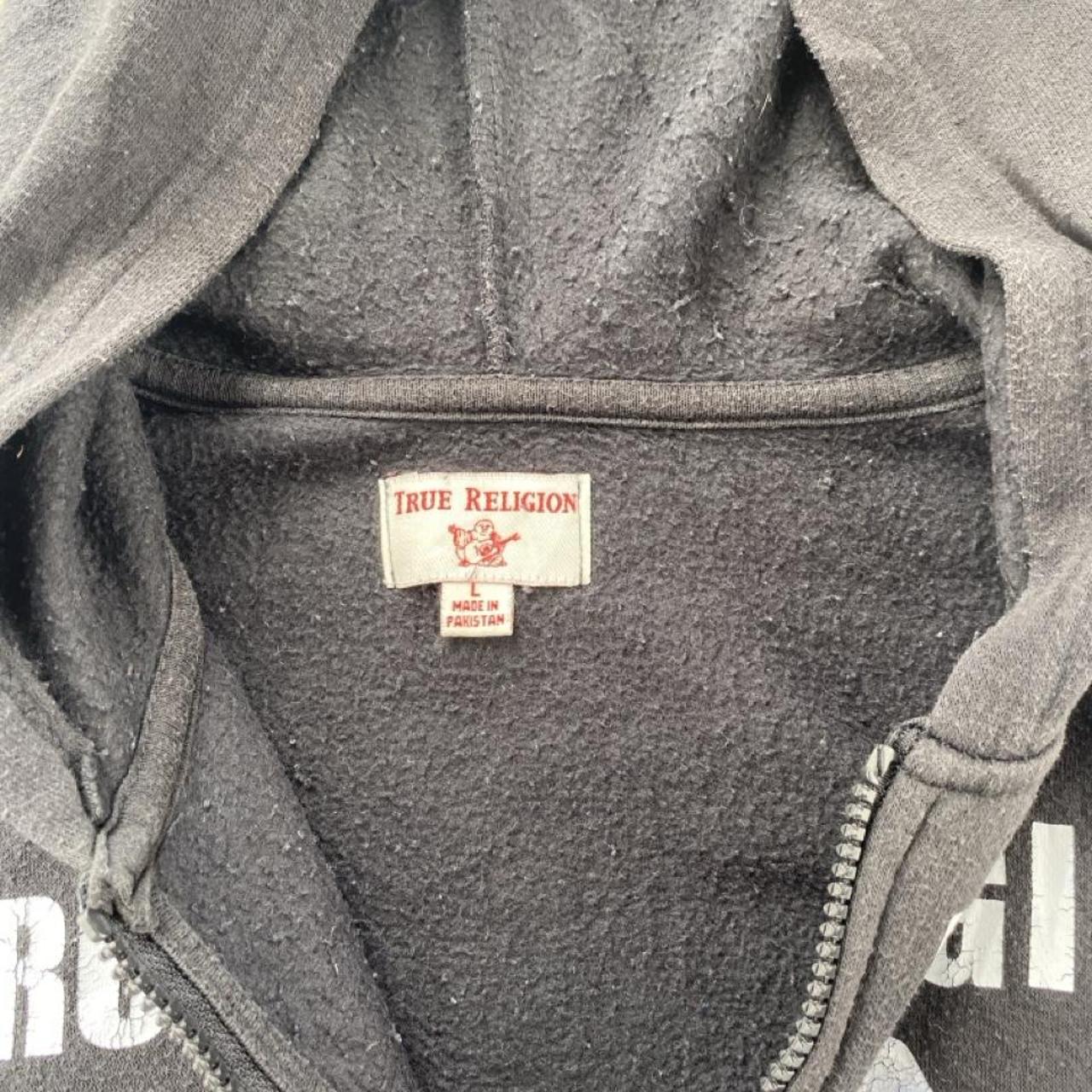 True Religion black and white full zip hoodie with logo and contrast stitching.