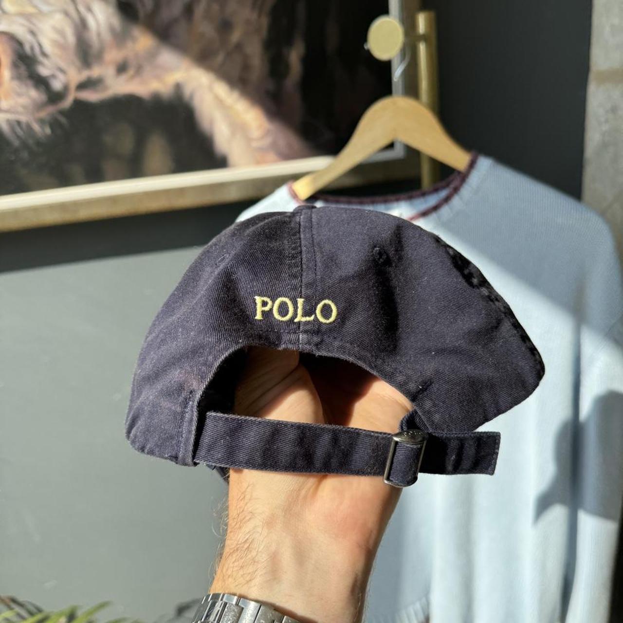 Polo Ralph Lauren navy hat with embroidered logo and adjustable strap.