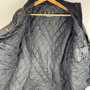 Barbour black women's winter jacket with logo detail and slim fit design.