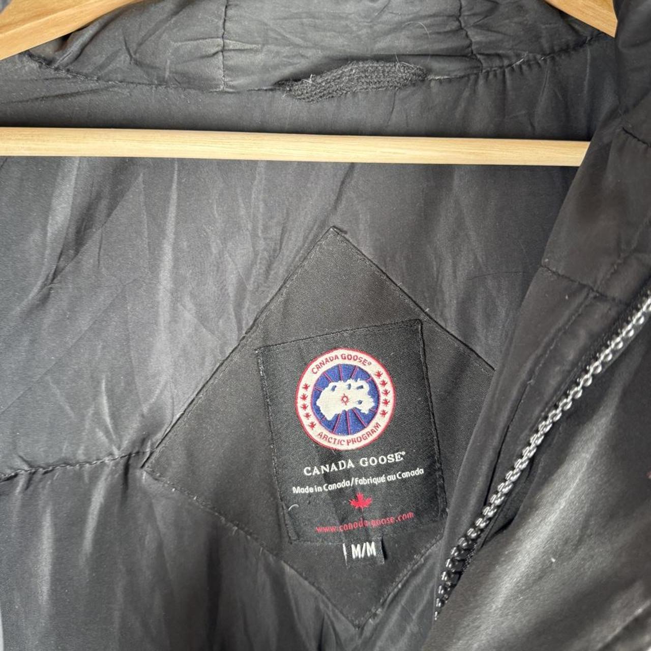 Canada Goose battered jacket black with no fur, badge, or visible holes.