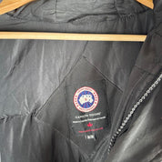 Canada Goose battered jacket black with no fur, badge, or visible holes.