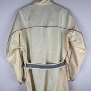 Belstaff cream motorcycle jacket with logo patch and shell material details.