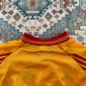 Adidas orange Benfica away jersey with embroidered logo and vintage design details.