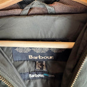 Barbour khaki women's thick down jacket with logo and signs of wear.