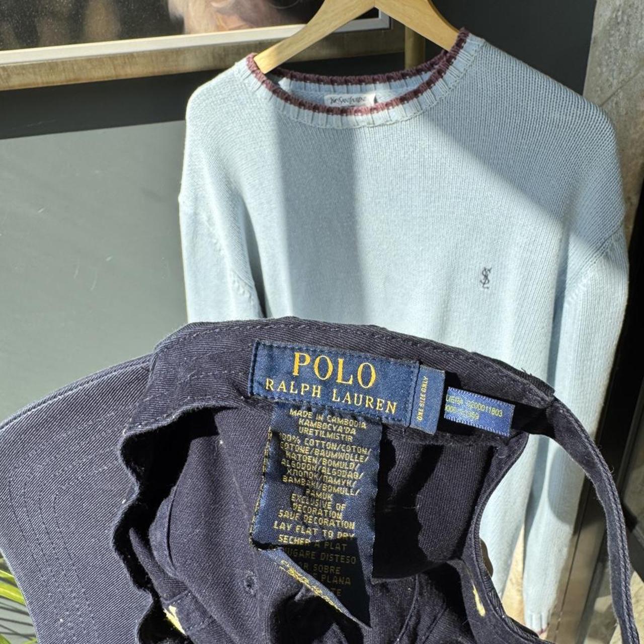Polo Ralph Lauren navy hat with embroidered logo and adjustable strap.
