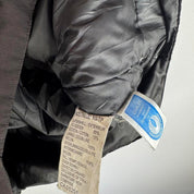 Canada Goose black down puffer gilet with logo patch and quilted texture.