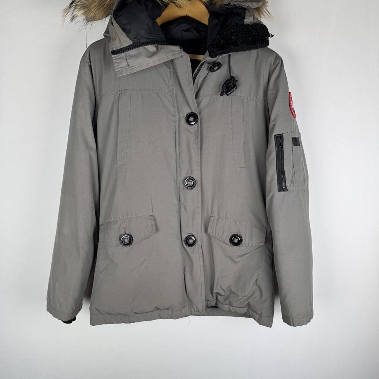 Canada Goose black Montebello parka jacket with fur-lined hood and logo patch.