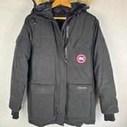 Canada Goose black parka jacket with logo patch and fur-lined hood.