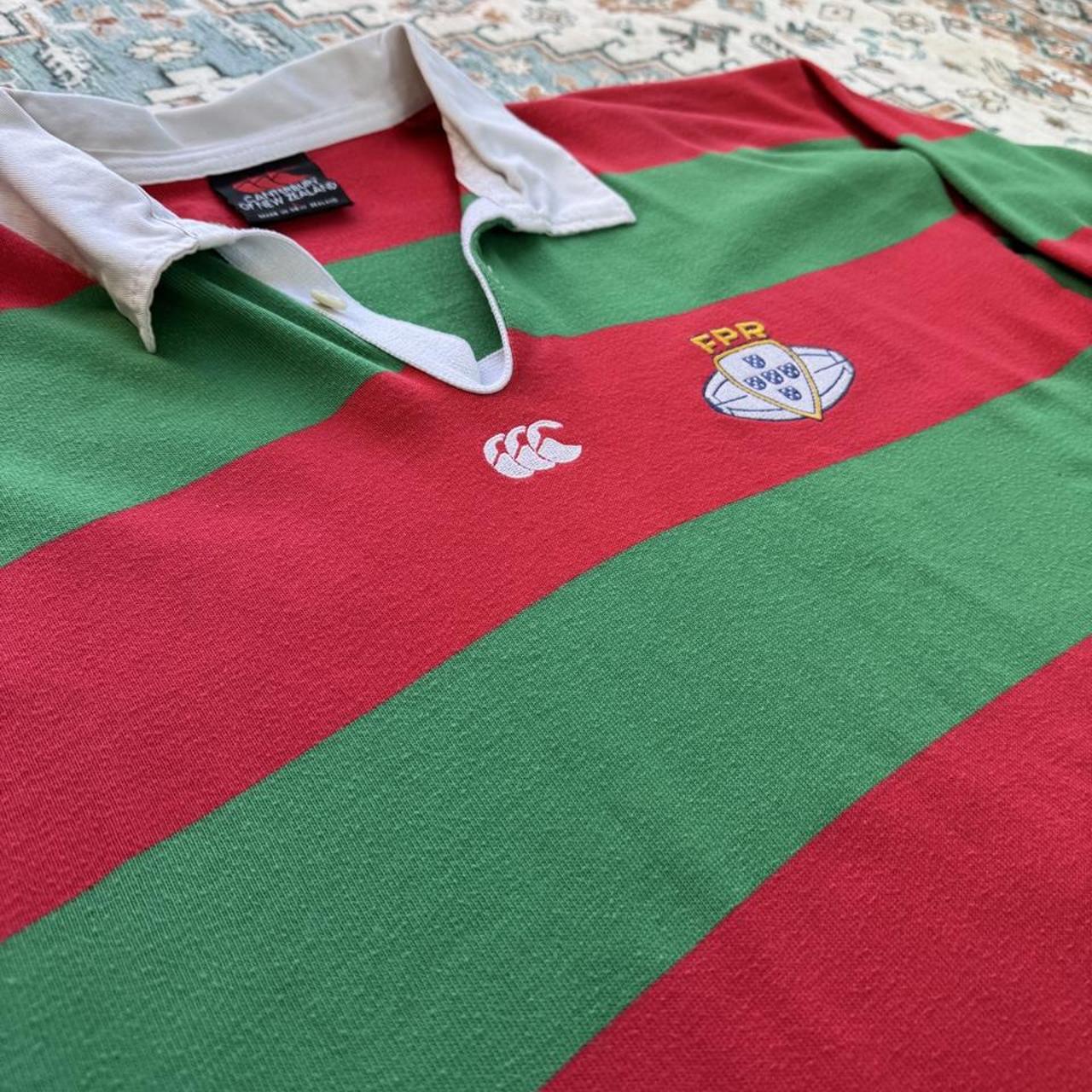 Canterbury men's rugby polo shirt red with embroidered Portugal logo and classic collar.