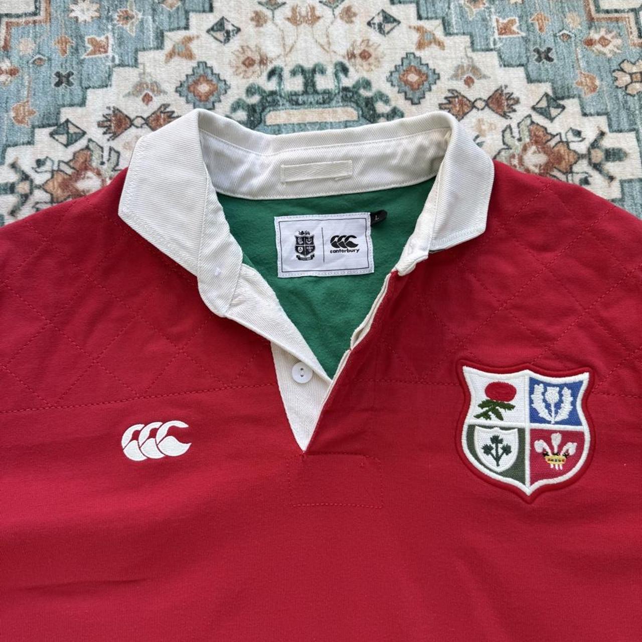 Canterbury men's rugby polo red with British and Irish Lions logo and embroidered details.