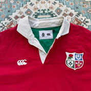 Canterbury men's rugby polo red with British and Irish Lions logo and embroidered details.