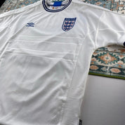 Umbro England home jersey, red with white logo and classic football design.